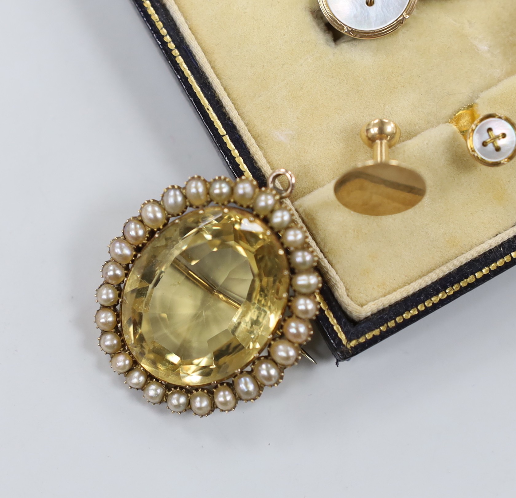 A late Victorian yellow metal, citrine and split pearl cluster set oval pendant brooch, 36mm, a Greek 875 yellow metal and simulated pearl ring, a chalcedony set spinning fob seal, a cased 9ct and mother of pearl eight p